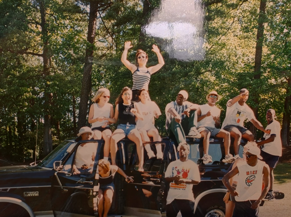 Tripoli and friends gathered outdoors during their school years