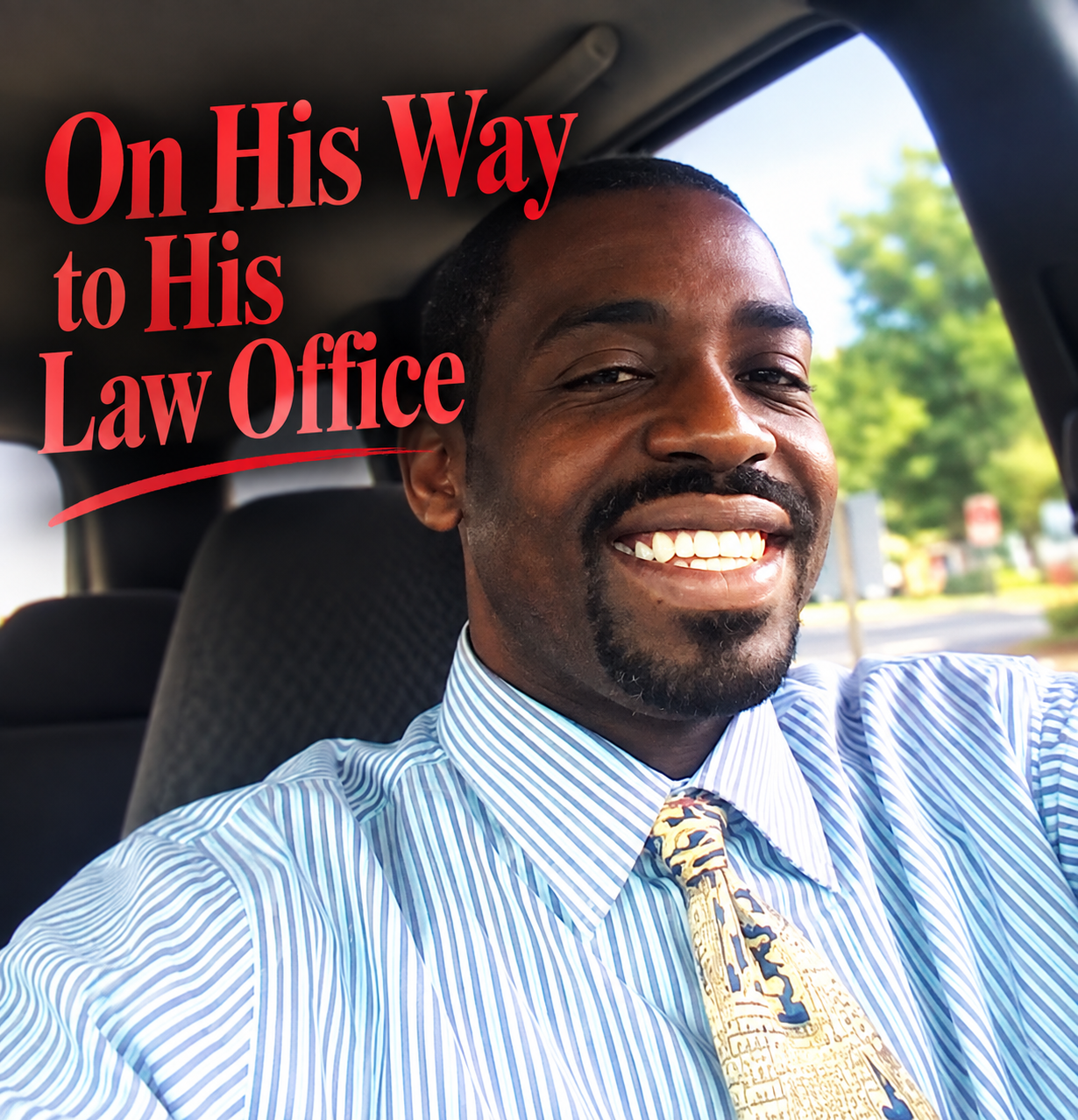 Tripoli smiling in his car on the way to his law office