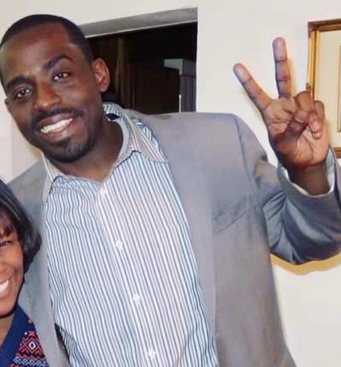 Tripoli giving a peace sign with a friend