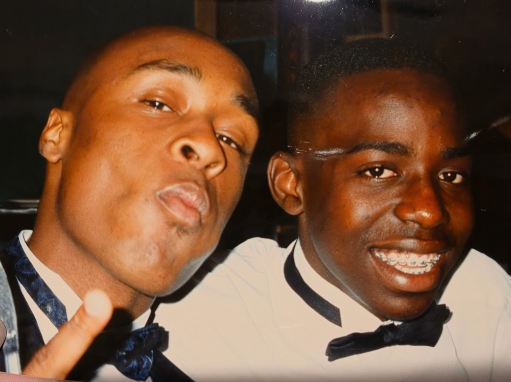 Tripoli smiling with a longtime friend at a school formal